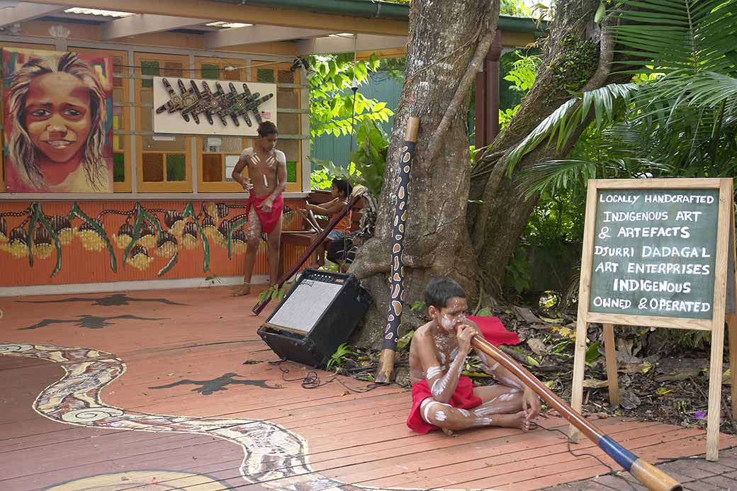 Boy playing didjeridu