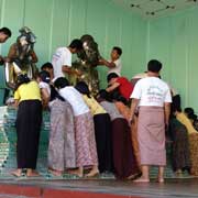 Polishing brass statues